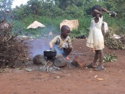 Photo of Children cooking over a fire